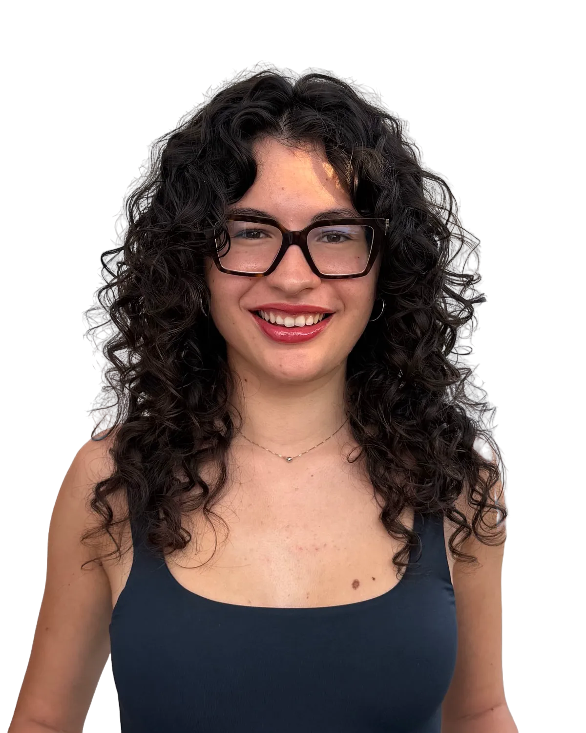 Sara smiling: long dark curly hair, thick square-framed glasses, a navy tank top.